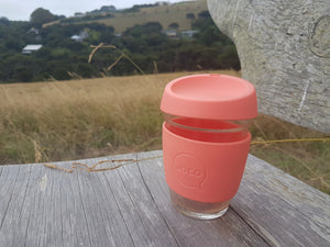 Joco reusable coffee cup 12oz in Persimmon made from silicone and toughened glass