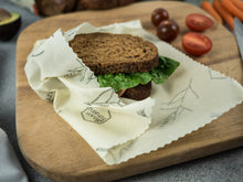 Honeywrap - Reusable Food Wrap. Wildflower Design Wrapping a Sandwich.
