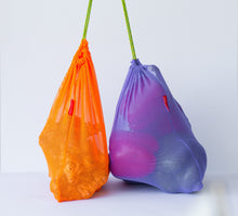 Goodie Bag in bright orange and purple with produce